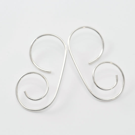 Pair of sterling G Spiral earrings on white background