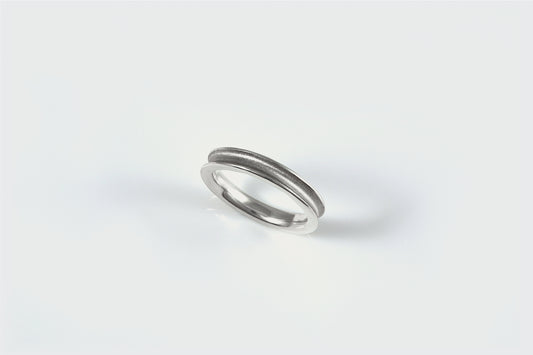 Sterling scoop band with textured center and shiny edges.  Notice the rounded inside edge to make it smooth to slide on and off of your finger.