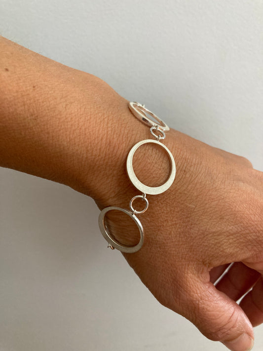 Sterling bracelet capturing the phase of a solar eclipse.